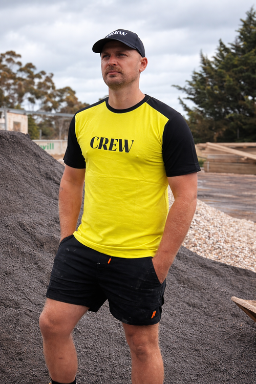 CREW yellow and black short sleeve work T-shirt with contrast sleeves and chest logo on white background